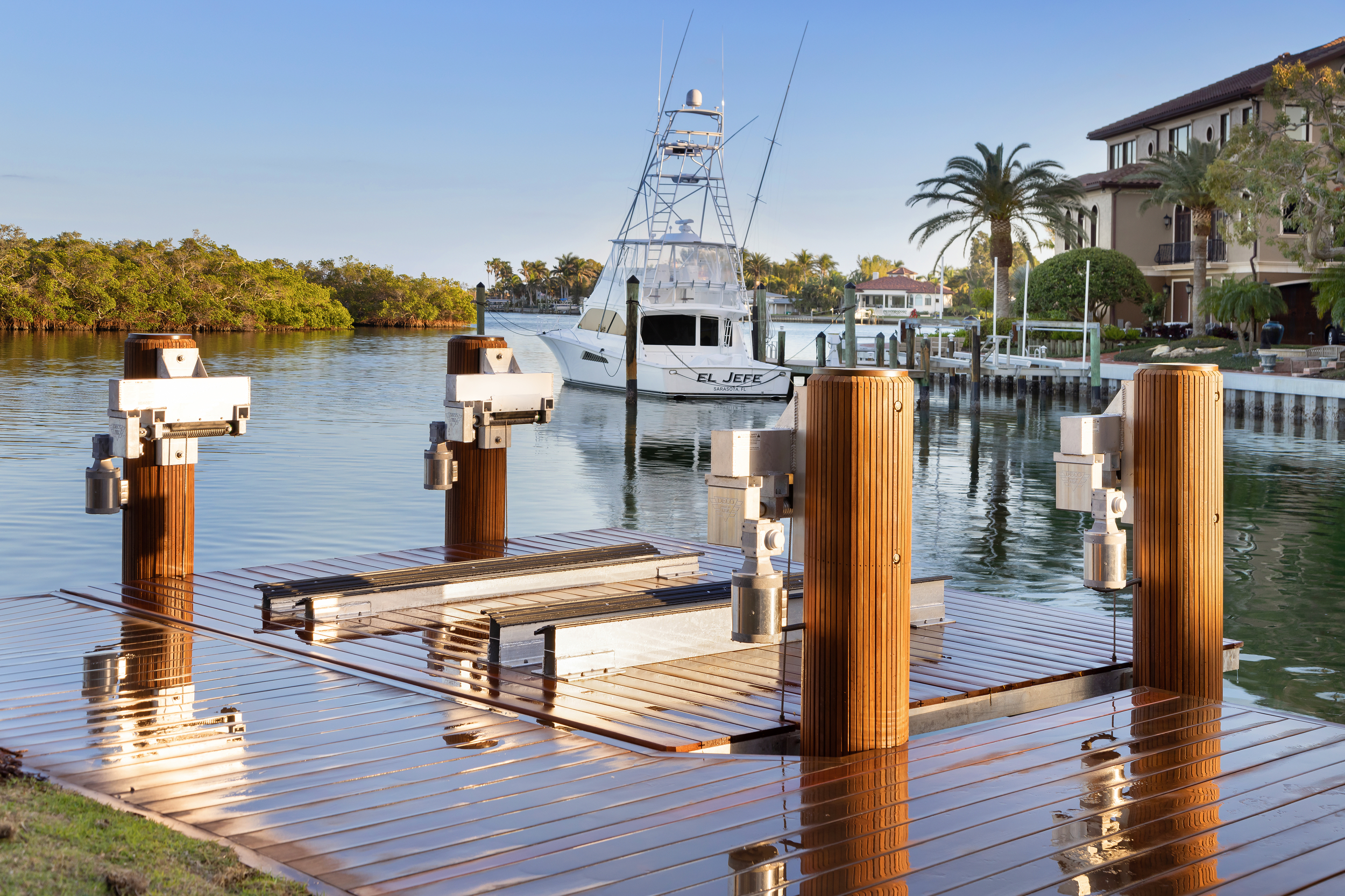 Custom boat lift with Epi wood dock on Lido Key, Sarasota, Florida.