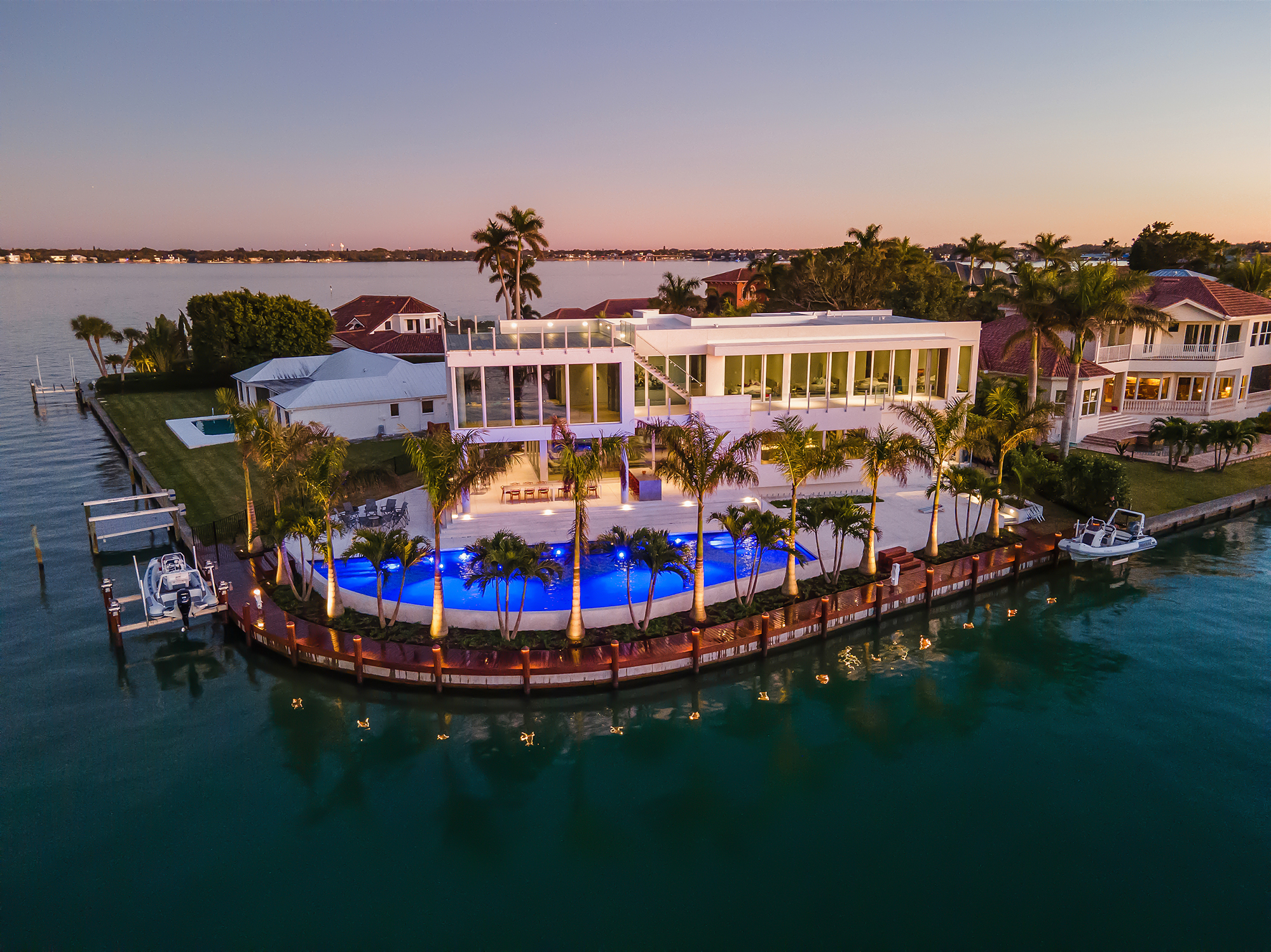 Luxury home with Epi wood boat dock and lift on Bird Key, Sarasota, Florida.